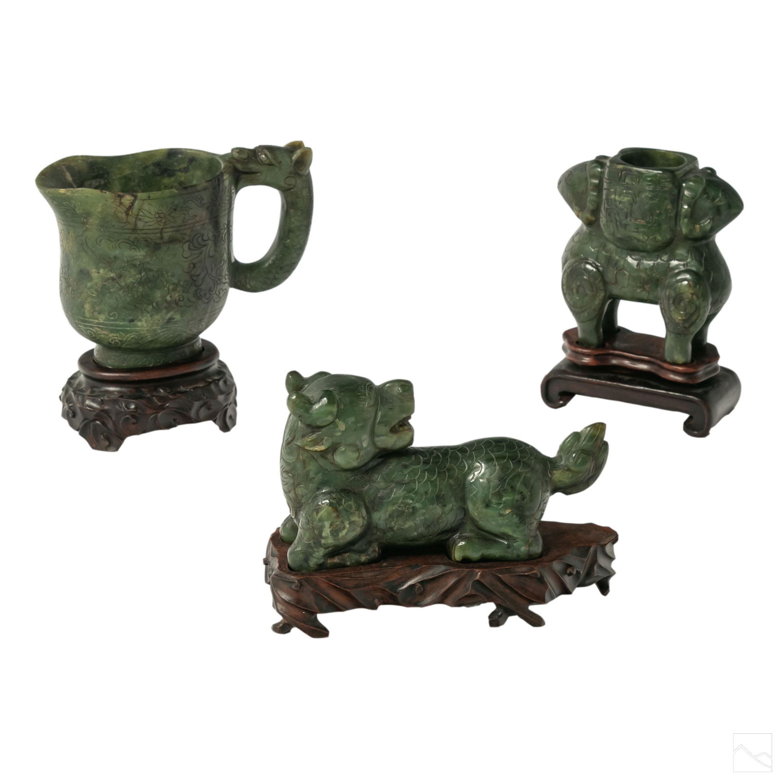 Chinese Antique Carved Spinach Jade Figurine Group: Three Chinese antique carved spinach jade figures with stands. Each features an etched surface design. Includes (1) 5 in. pitcher with dragon handle. (1) 5 in. dual rams head footed vase. (1) 4 in. ca