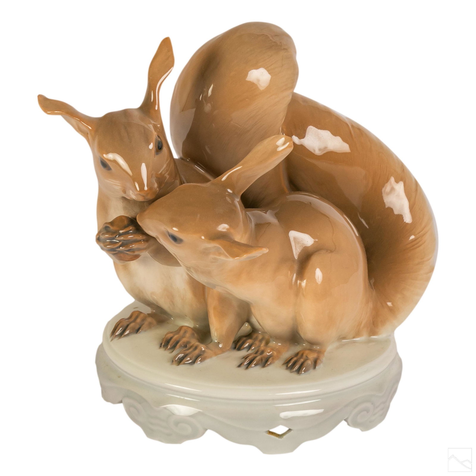Royal Copenhagen Antique Glazed Squirrels Figurine: Crafted of fine quality Danish porcelain. Designed by Christian Thomsen (1860-1921). Depicts a cute pair of squirrels. Base with reticulated design. Bears Royal Copenhagen backstamps. Artist mark on r