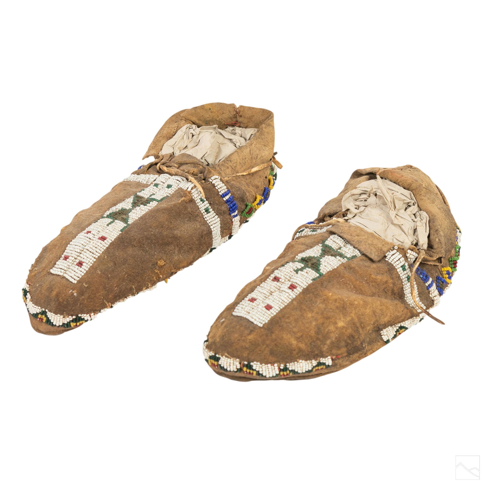 Native American Indian Cheyenne Arapaho Moccasins: Pair of early Southern Cheyenne or Arapaho Native American Indian woman's moccasins. Light Leather shoes embellished with beaded motif in tribal designs featuring white, blue, red, green, yellow and b