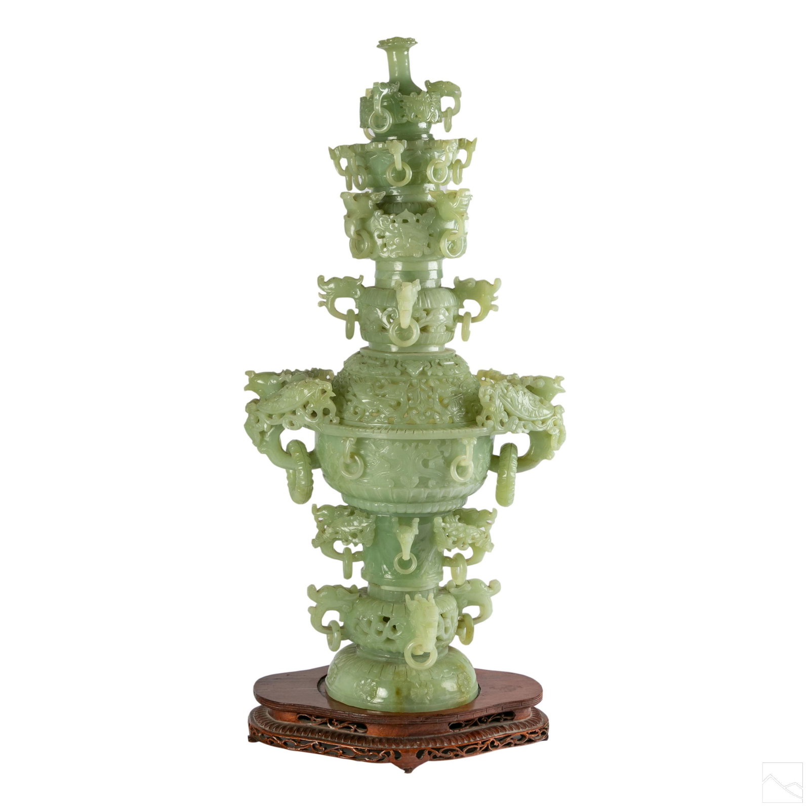 Chinese Carved Celadon Jade Tower Pagoda Sculpture: Vintage Chinese export carved celadon jade type stone pagoda tower sculpture. Hand carved from light green hardstone. Features captive ring dragon and elephant heads with ornate filigree scroll work. 