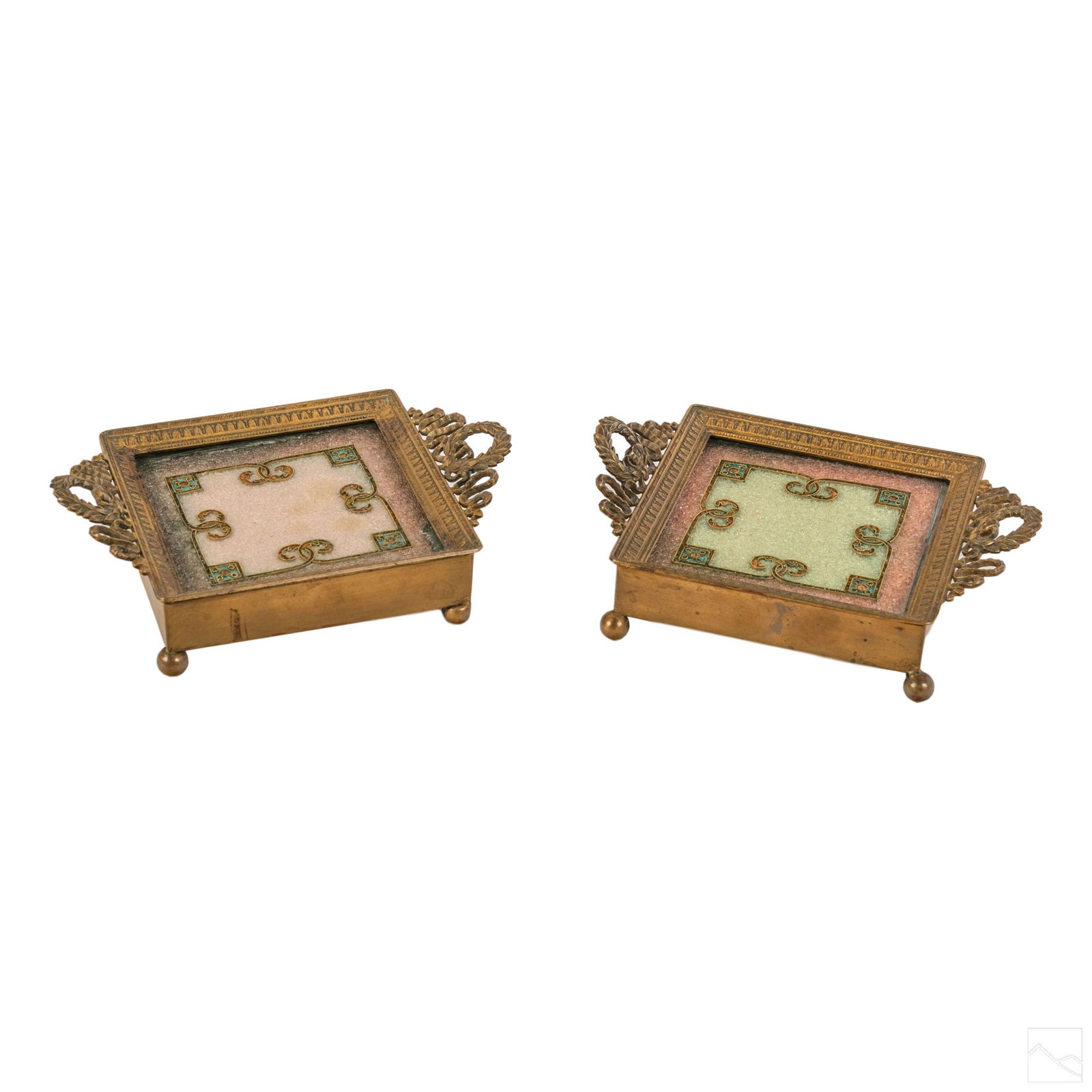 French Bronze Antique Framed Glass Coaster Trays: A pair of footed bronze framed coaster trays. Ornate wreath handle design and ball feet. Features glass top with internal glass beads and wire motif. SHIPPINGHill Auction Gallery will offer in-house c