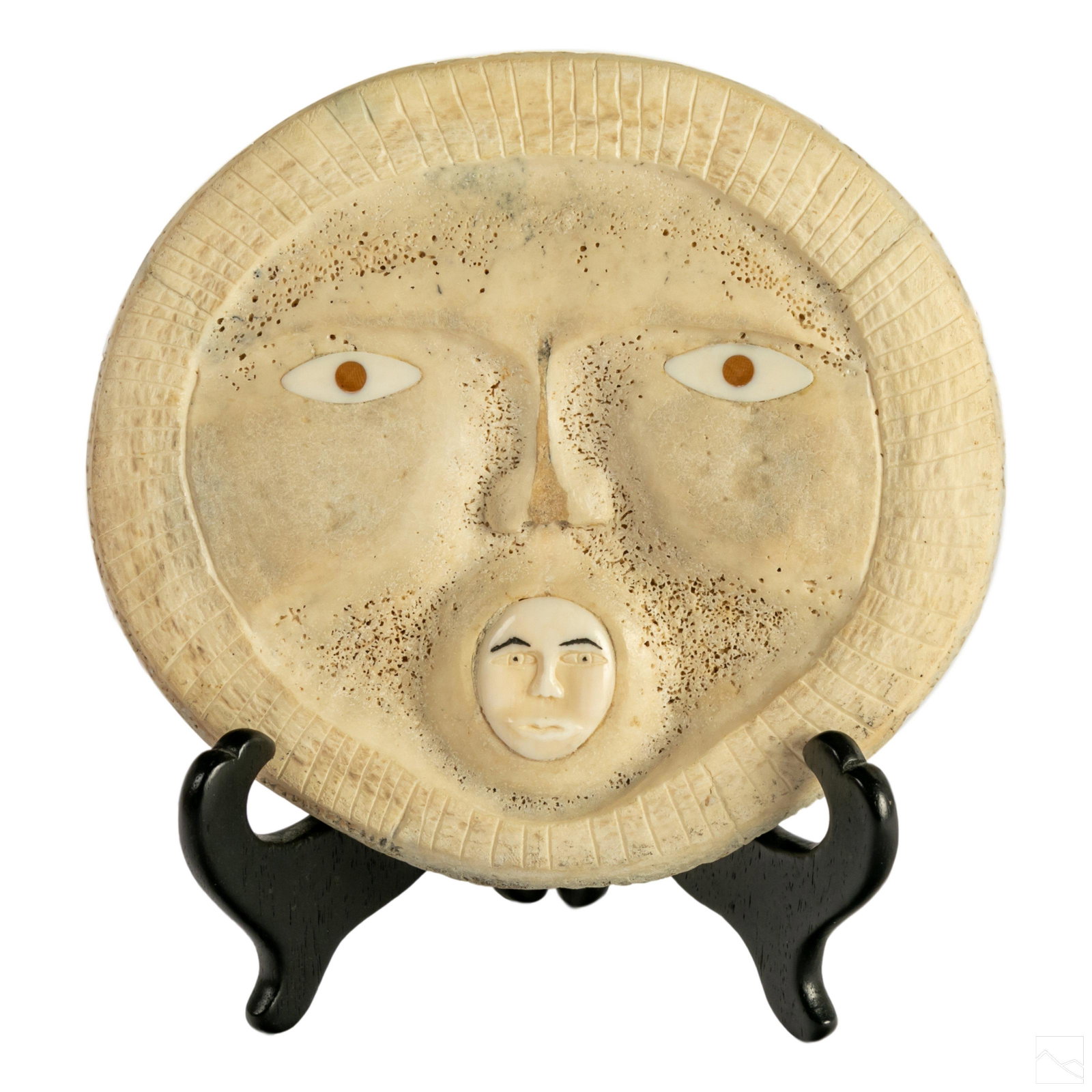 Native Inuit Carved Whale Bone Mask Baleen Inlays: Native Alaskan Inuit carved whale bone mask. Inlaid pupils with copper irises. Small mask in the mouth. Made in Shishmaref, Alaska. Signed, J. Eningowuk. Includes black stand. SHIPPING Hill Auction Ga
