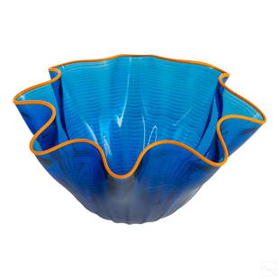 Modern Studio Art Glass Seaform Centerpiece Bowl: Mystery artist (20th Century) Studio art glass bowl in the manner of Chihuly. Features a organic free form style in blue with a yellow trim bead along the rim. Signed and dated '07 on base. SHIPPINGHi