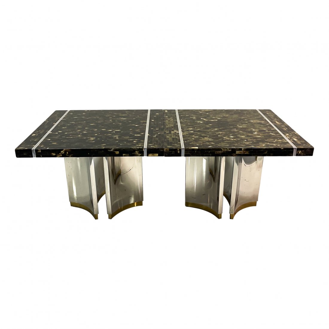 Tessellated Horn Dining Table style Enrique Garcel: Mid century modern dining room table. Table finished in tessellated veneered horn in a hair and bone pattern with a chrome base. Dinning table is comprised of two individual pieces. The pieces can be