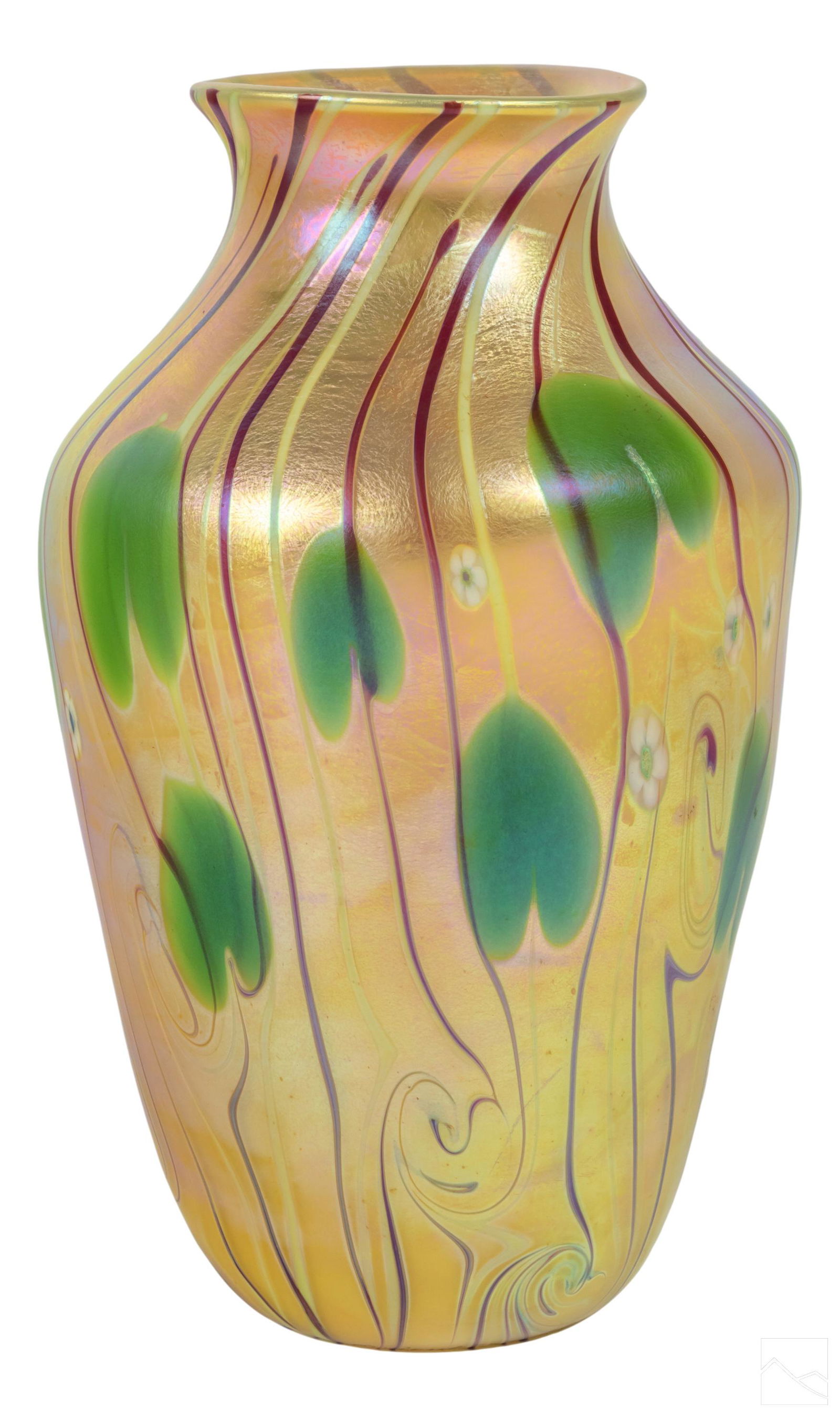 Orient & Flume Millefiori and Lily Pad Glass Vase: 20th Century art glass vase by Orient & Flume. Features lily pads and millefiori design over a gold iridescent ground. Includes original 1979 pamphlet with registration number. SHIPPINGHill Auction Ga