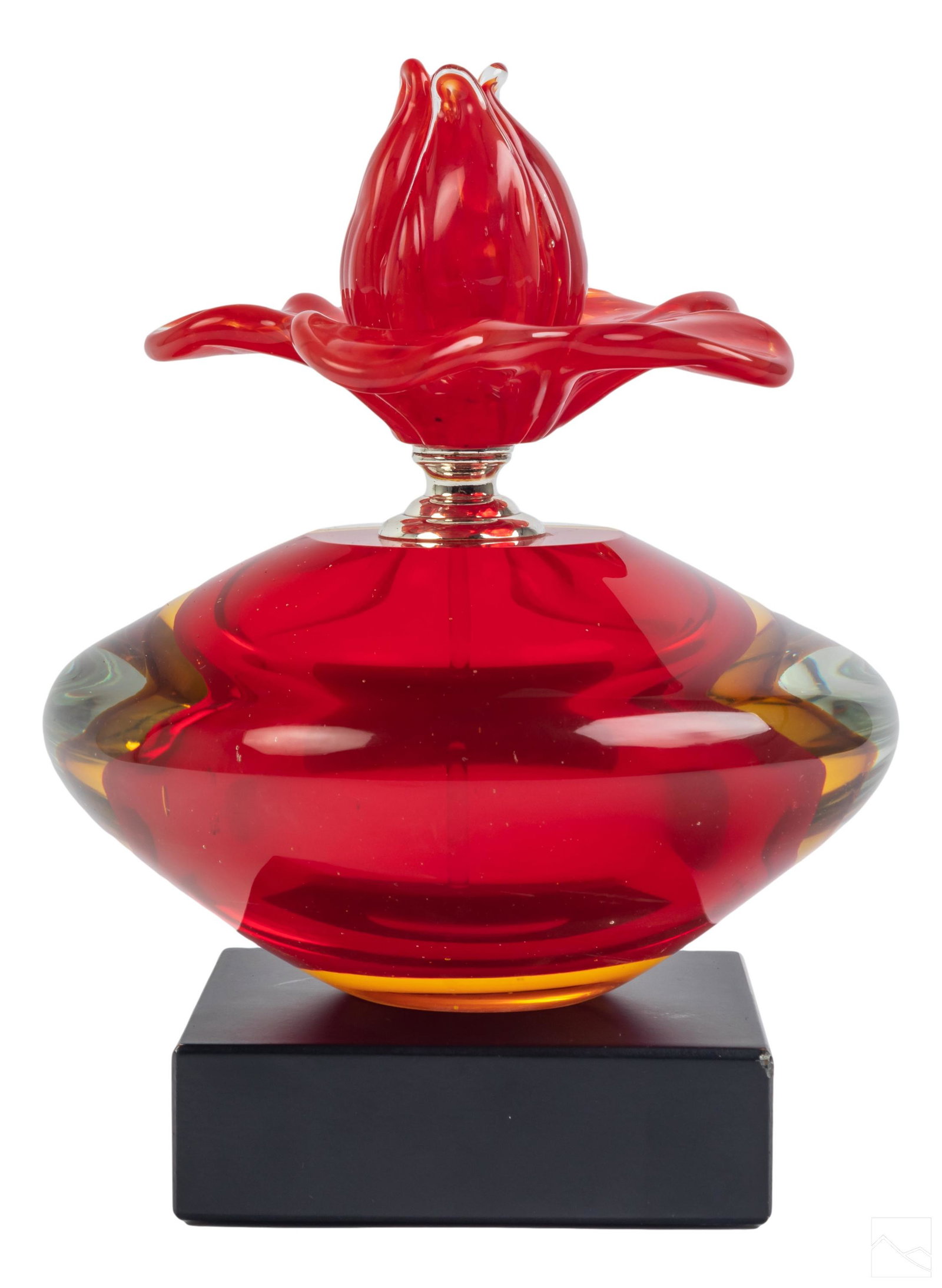 Murano Sommerso Art Glass Flower Perfume Bottle: Murano Venetian art glass floral perfume bottle. Features red and orange sommerso glass encased in clear crystal. Feature flower shape twist top with chromed metal hardware and a glass stem dabber, di