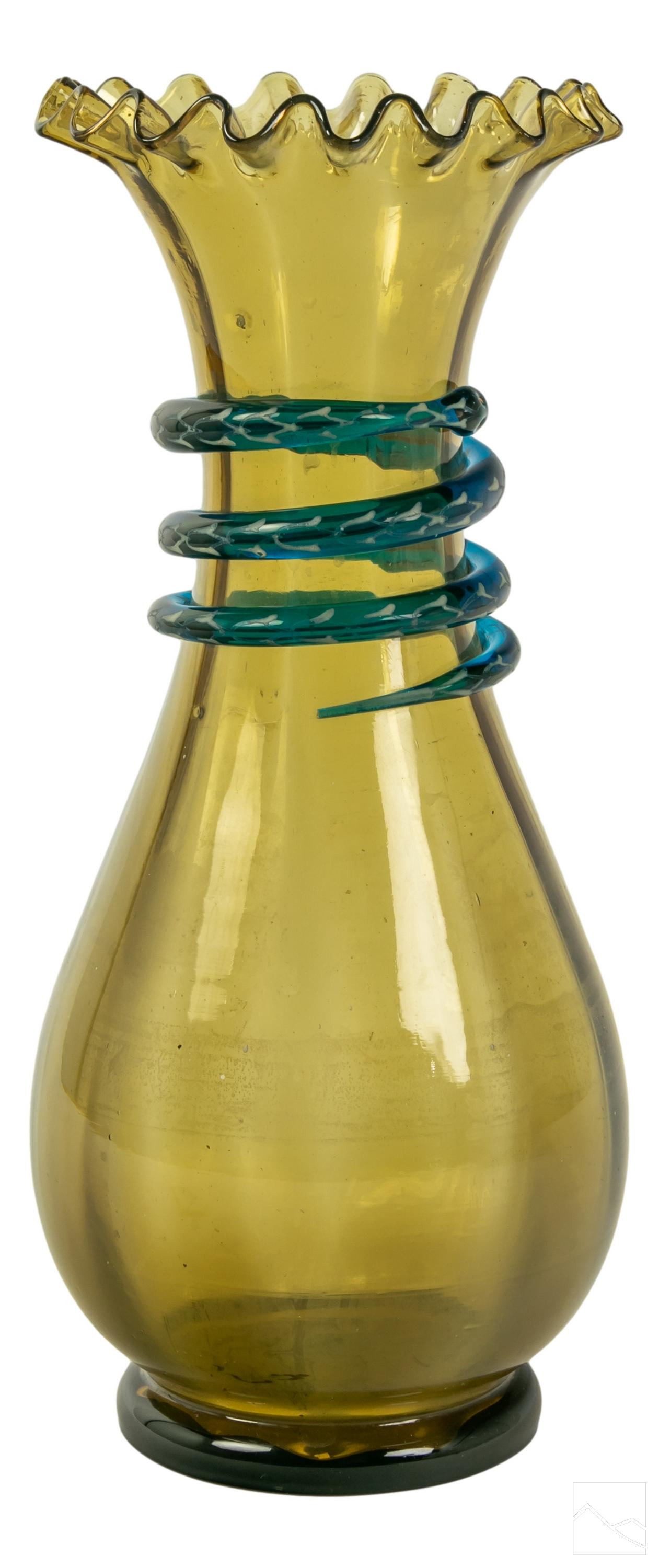 Victorian Antique Art Glass Ruffled Top Snake Vase: Antique Victorian art glass ruffled top vase. Hand crafted amber toned glass, with a blue glass snake coiled around the neck of the vase, featuring silvered white detailed embellishments. No apparent