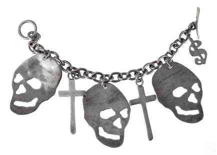Andy Warhol by Robert Lee Morris Skulls Bracelet: Produced for the Andy Warhol Foundation by Robert Lee Morris (born 1947). Three skulls, two crosses, and one money charm. Total weight 75.4 grams. Marked on verso of one skull "The bored langour"