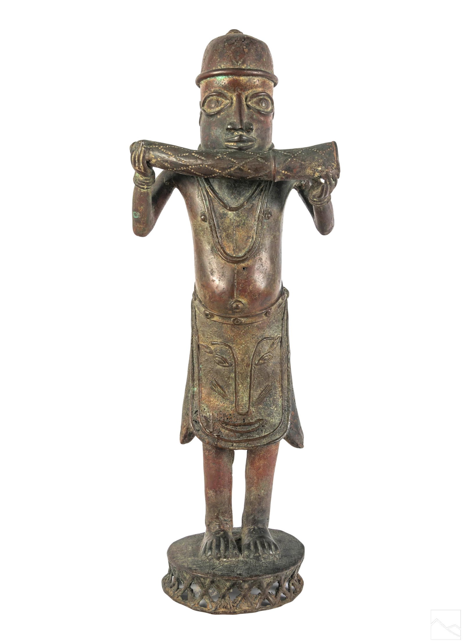 African Bronze Benin Style Figural Music Statue: 20th Century African art bronze sculpture. Depicts a Benin warrior, wearing a helmet, skirt, and playing a oliphant or tusk flute. Accompanied with photocopy of appraisal. Dimensions: 25 X 10 X 7 in. 