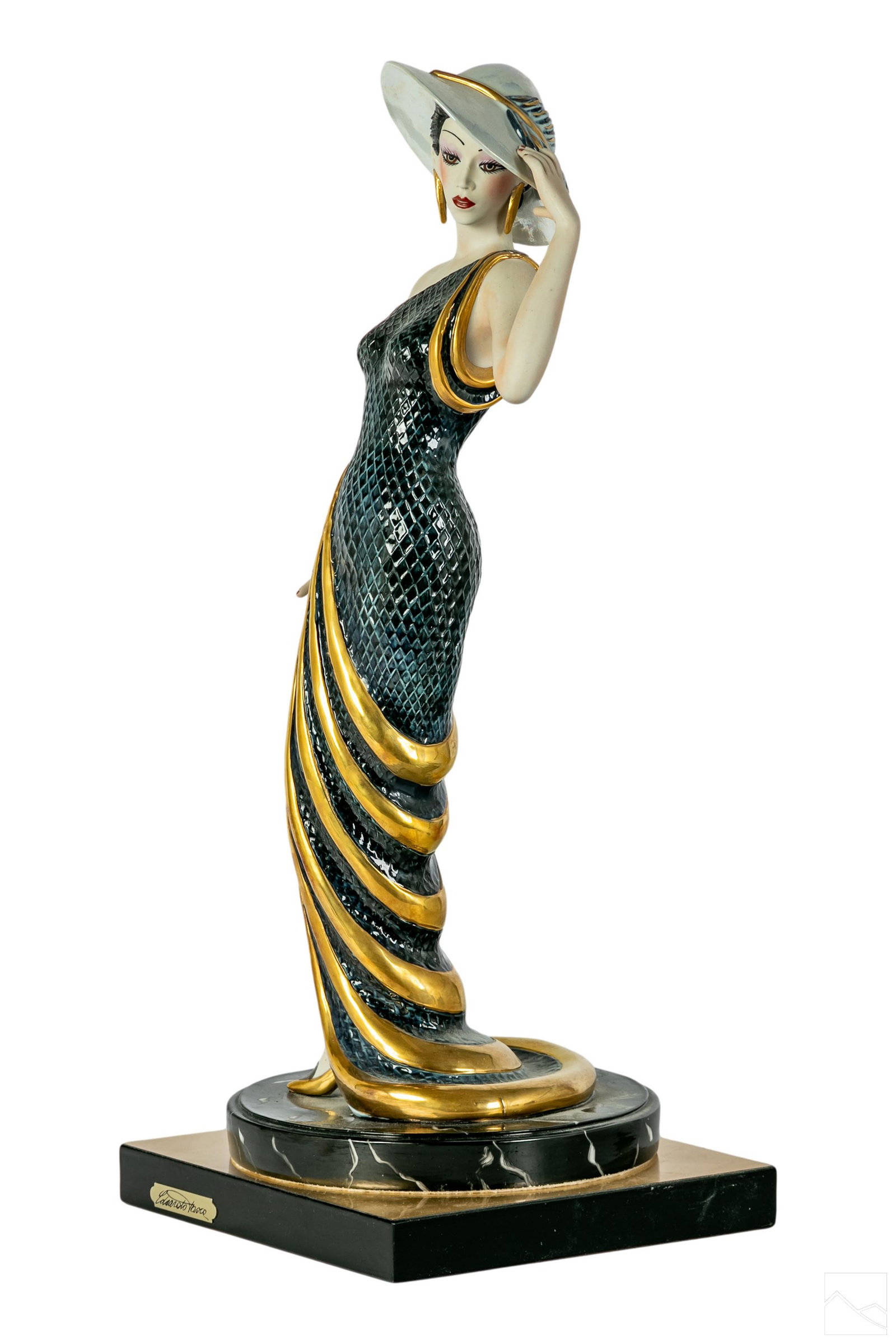 Edoardo Tasca Italian Porcelain Figural Sculpture: A limited edition Edoardo Tasca Capodimonte Italian porcelain figurine. Limited edition marked 902. Flowing gold and black gown one bare shoulder neckline with matching gold hat. Done in Art Deco styl