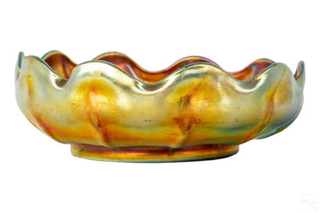 Louis C. Tiffany Gold Favrile Glass Scalloped Bowl: Louis Comfort Tiffany (American, 1848-1933). Early 20th Century Favrile art glass bowl. Features a striking iridescent golden color with scalloped edges. Signed with monogram on bottom LCT