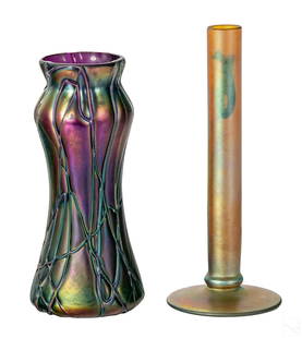 Gold Aurene & Purple Iridescent Art Glass Vase LOT: An estate lot of two (2) iridescent shelf floral bud vases. One aurene with golden finish (possibly Steuben) having cylindrical body. Etched hand inscribed on bottom AURENE 2556. The purple lavender