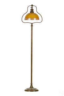 Roycroft Bronze Floor Lamp with Steuben Type Shade: Roycroft attributed possibly Handel bronze floor lamp with golden Aurene art glass shade. Floor lamp has heart shaped opening to hold the shade. Shade is done in gold aurene. Floor lamp is wired not