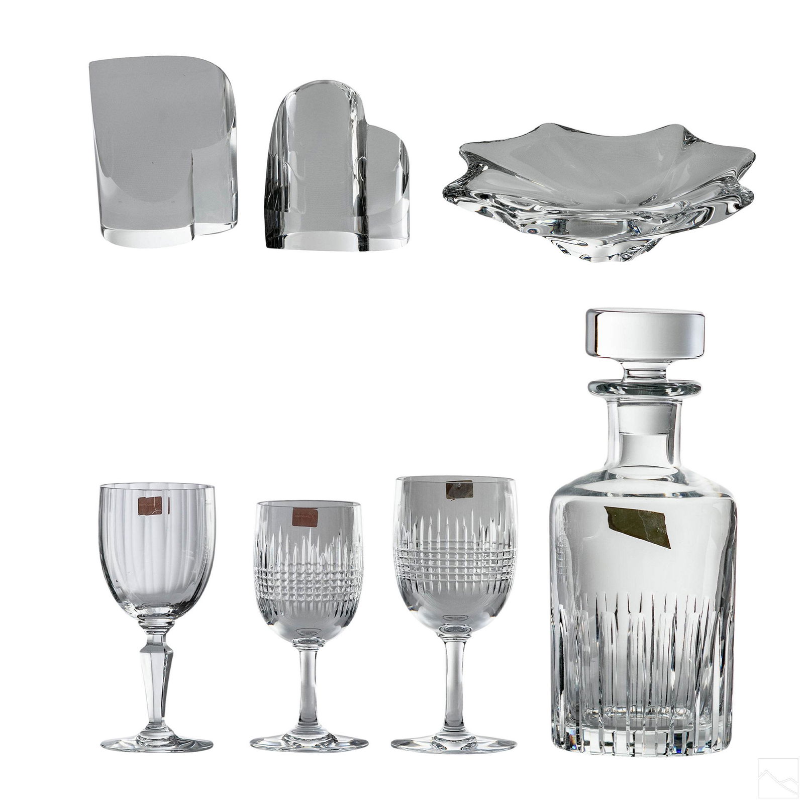 7pc Baccarat and Steuben Fine Quality Crystal LOT: An estate collection of seven pieces of fine crystal. Lot Includes (5) five pieces of BACCARAT crystal, one (1) decanter with stopper; three (3) wine or claret stemware glasses; one (1) abstract leaf