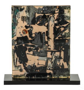 Arthur Secunda 1927-2022 Modern Lucite Sculpture: Arthur Secunda (American, 1927-2022). A cast lucite sculpture. A rectangular form featuring inclusion of charred objects collected after the 1968 Watts Riots in Los Angeles. Presented with a black rec