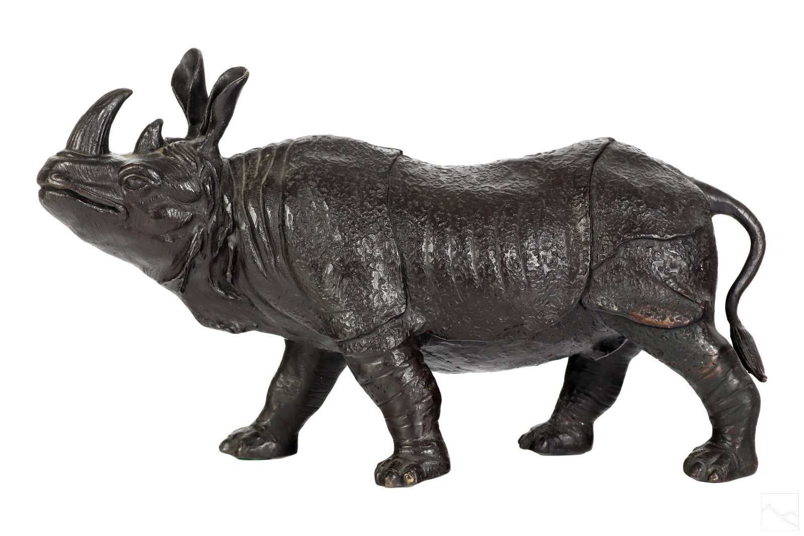 Realistic Wild African Rhinoceros Bronze Sculpture: 20th Century realistic wildlife work depicting a standing bull rhinoceros, modeled in a Mannerist style with armored plates and other details. No apparent signature. Dimensions: 10 X 17 X 6 in. Condit