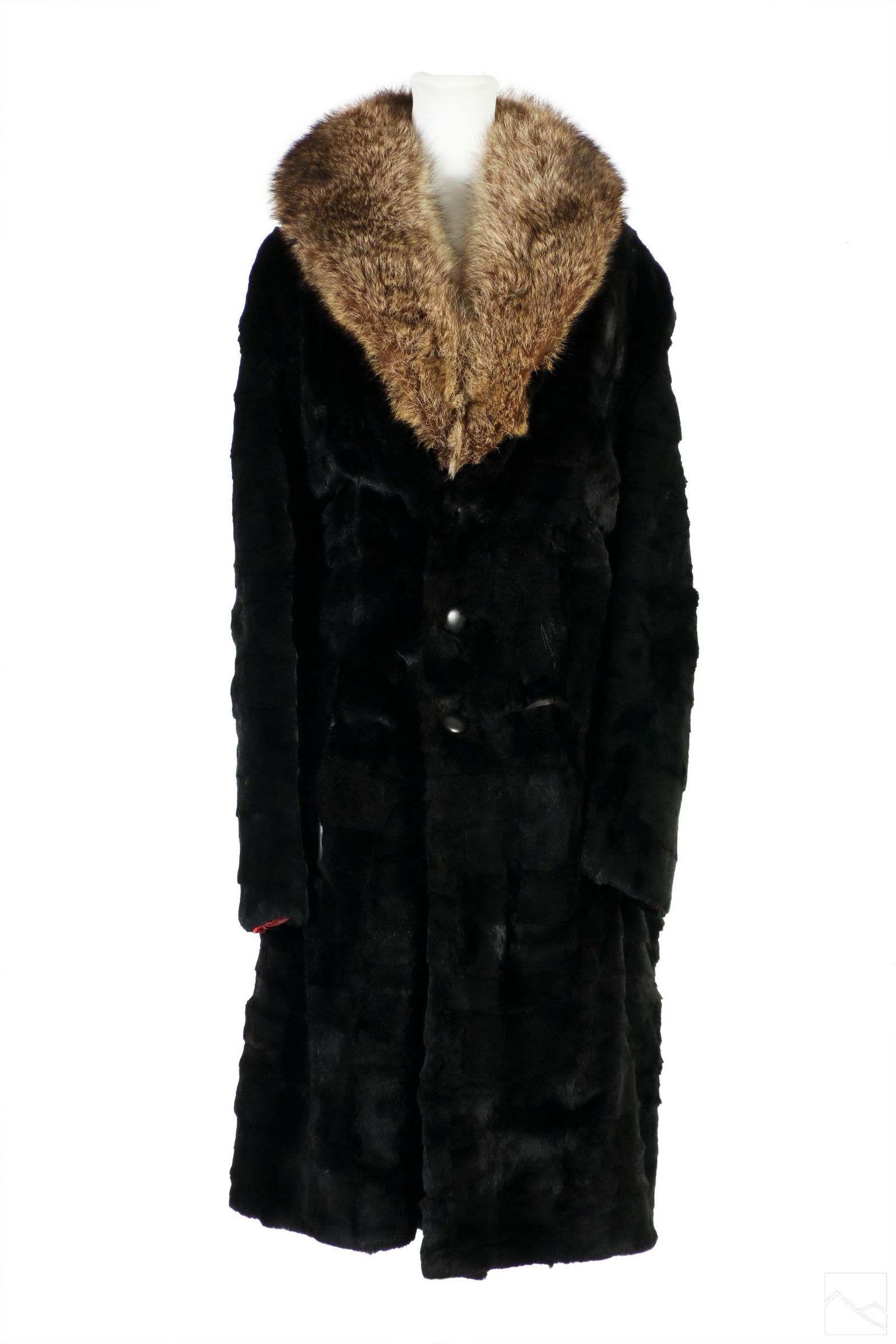 Ladies Designer Black Chinchilla and Fox Fur Coat: A vintage ladies designer black chinchilla fur coat with fox fur trim, produced circa 1960s. Leather lined pockets with leather wrapped three button closure. Embroidered interior lined in red fabric.