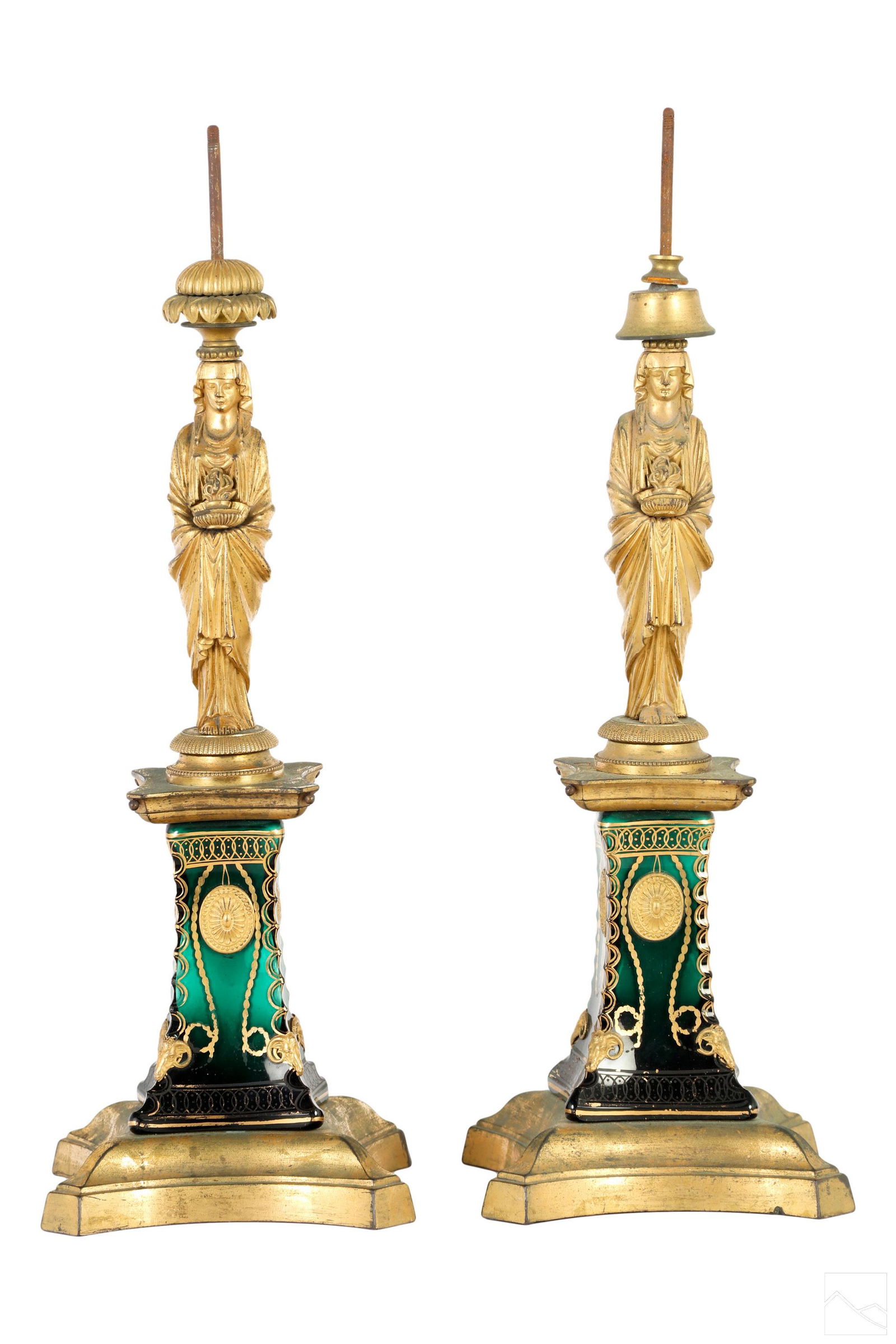 French Empire Bronze Neoclassical Garniture Bases: A pair of bronze French Empire garniture lamp bases. Figural works modeled with Neoclassical Vestal Virgin figures in traditional Roman robes and headdresses, and carrying sacred lamp of fire. Mounted