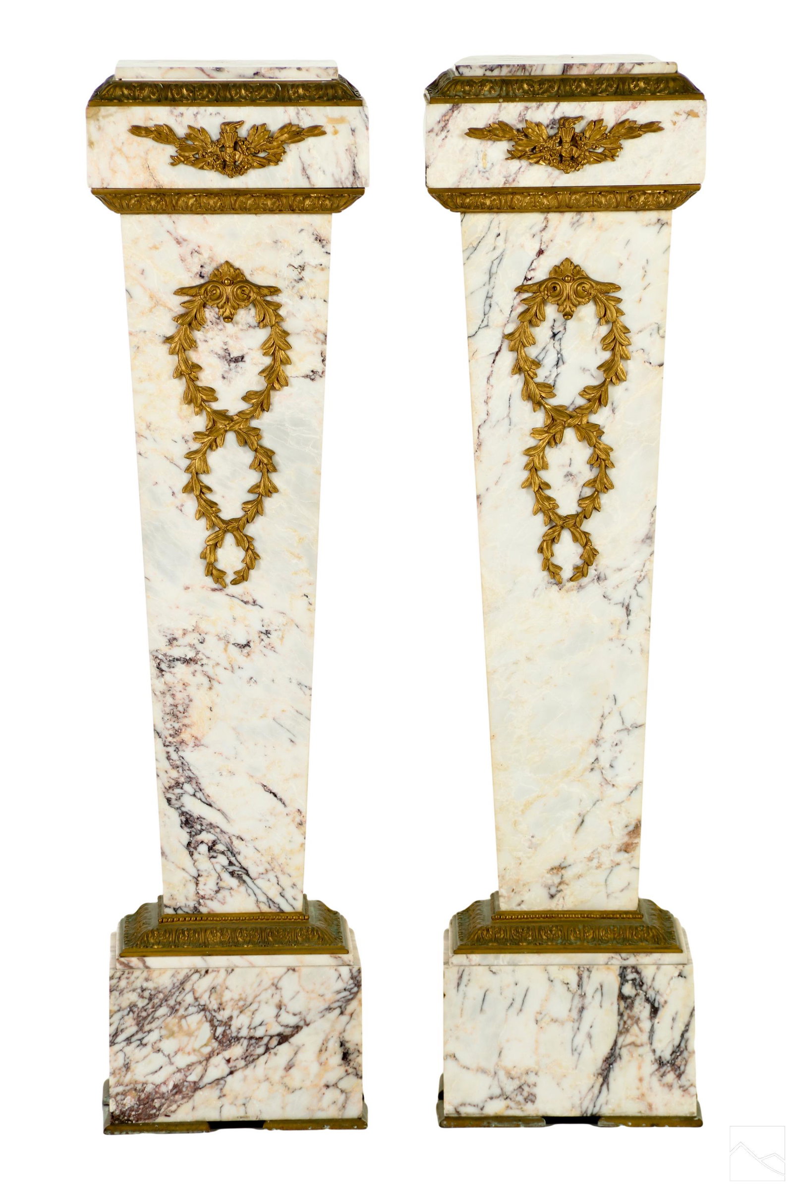 French Empire 19C. Antique Rococo Marble Pedestals: A pair of antique 19th Century French Empire style marble pedestals. Features beautiful veining marble with Rococo scrolling design gilt dore bronze wreath floral motif. No apparent signature. Dimensi