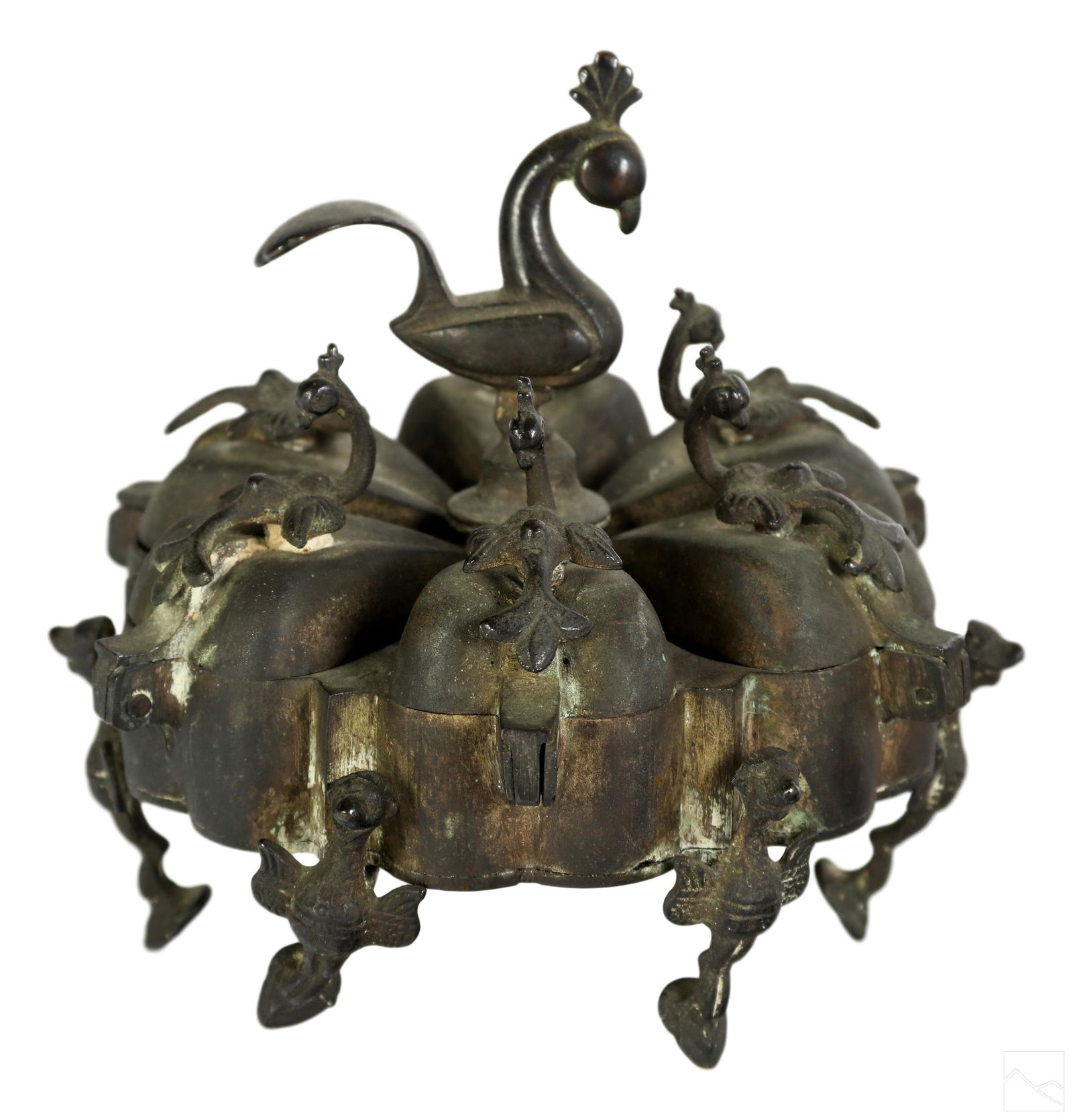 Mizner Estate Indo Persian Brass Peacock Spice Box: An Indo Persian antique brass spice or salts box. A decorative sectioned server with striking peacock motif. Six lidded compartments for spice storage with peacock finials and large central peacock ha