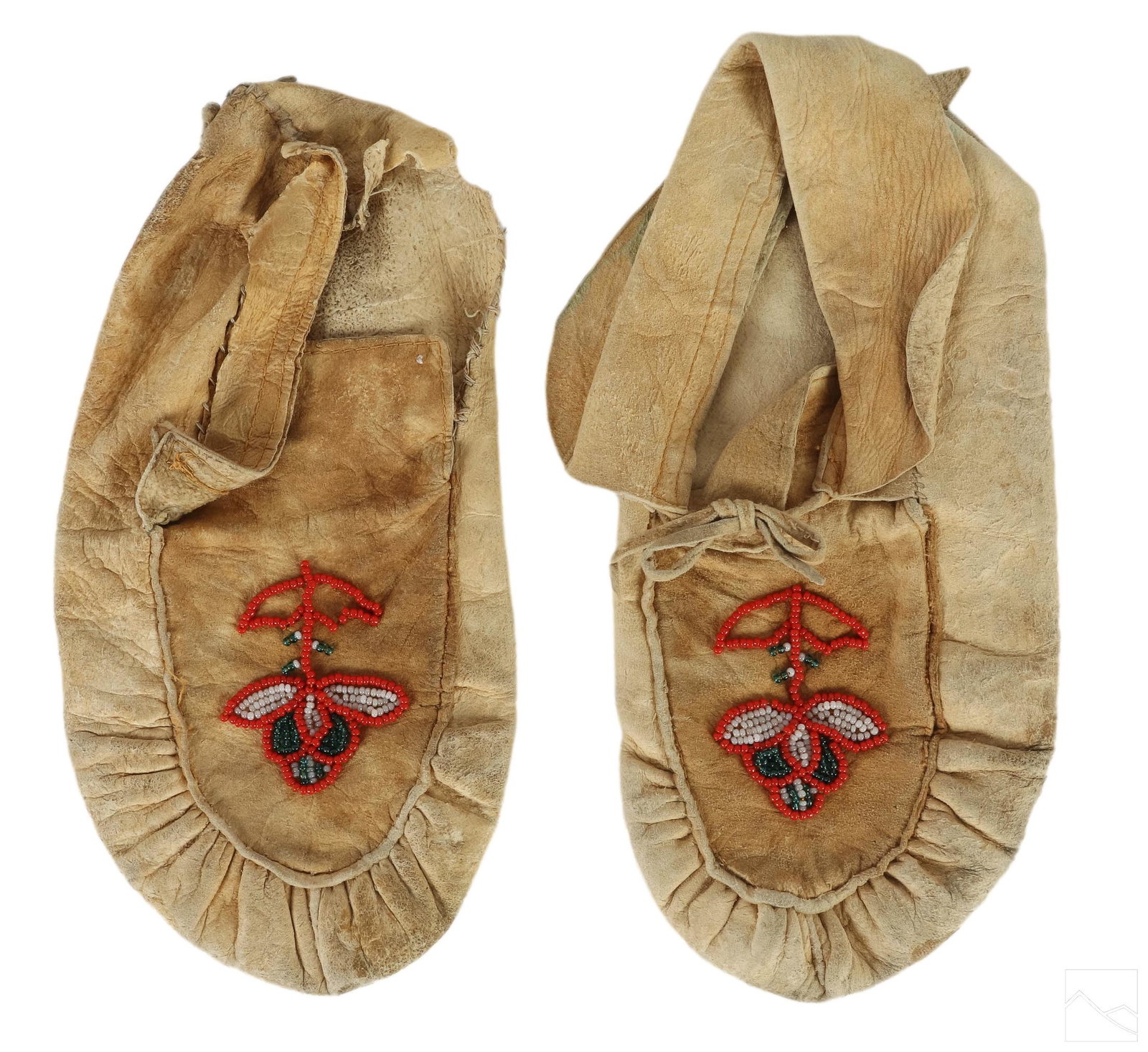 Native American Indian Soft Leather Moccasin Shoes: A pair of Native American artisan produced moccasin shoes. Soft leather with bead embellishments. Red, white and grayish blue floral designs. No apparent signature. Sole of each shoe measures approxim