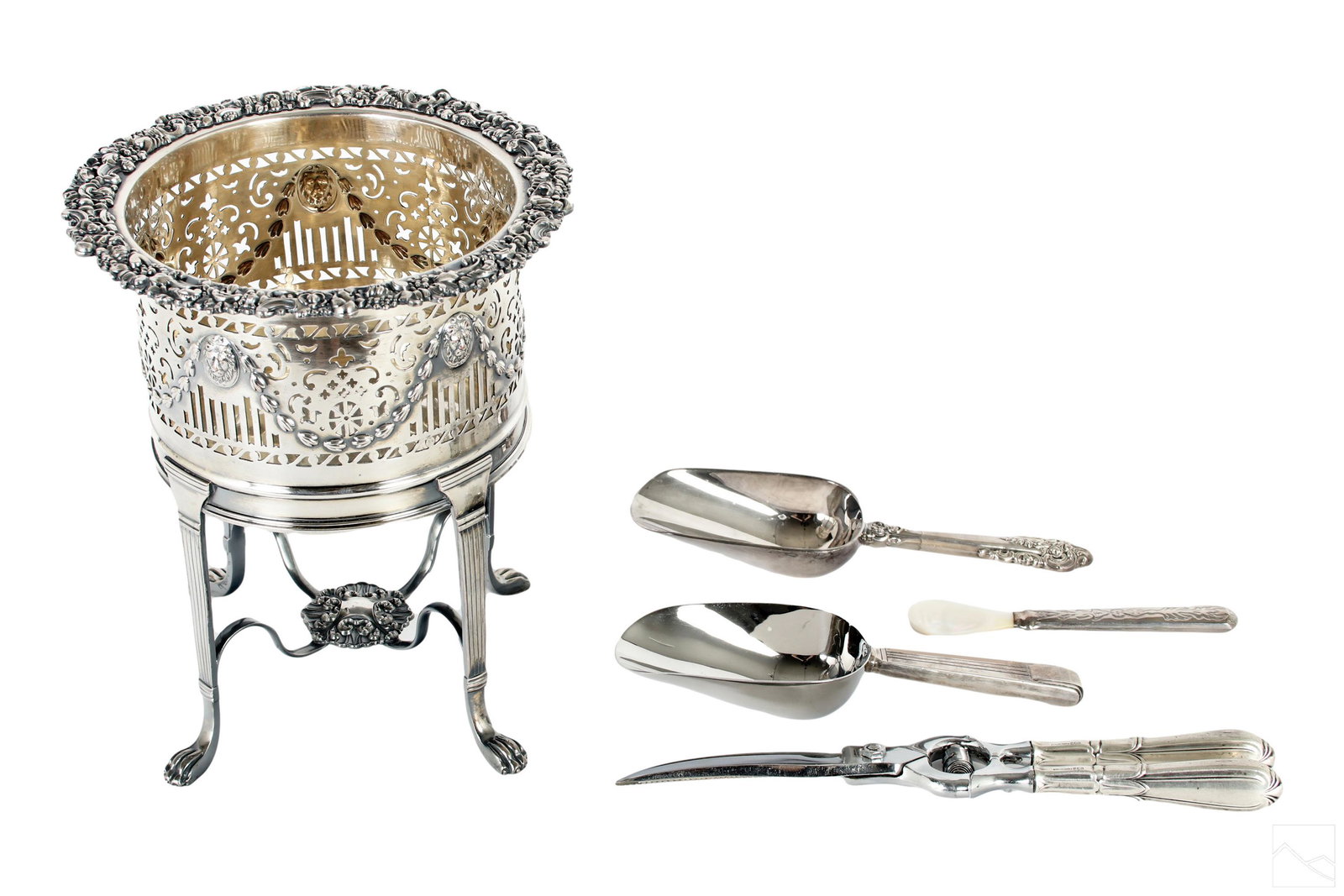 Silverplate Wine Stand & Silver Handled Server LOT: An estate collection featuring silverplated pieces and items with sterling silver handles. Includes: one (1) ornate silverplated Art Deco style footed champagne or wine bottle stand with pierced retic
