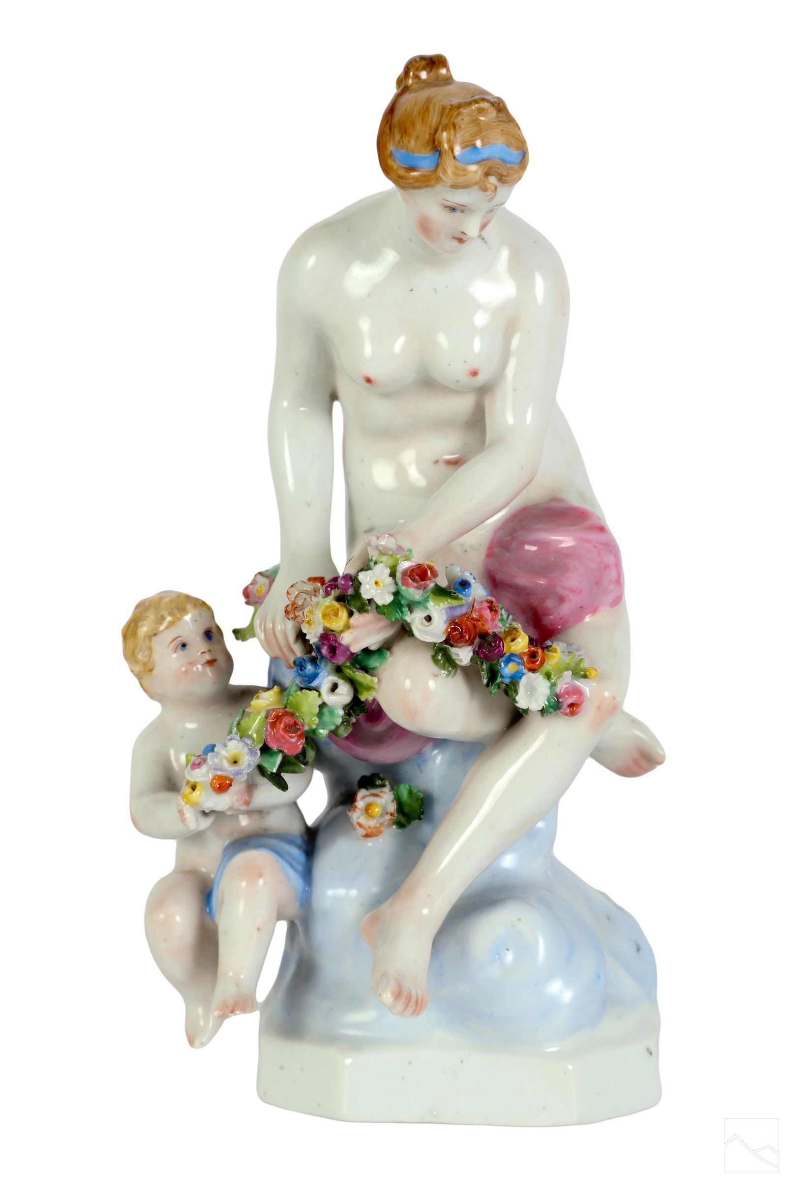 Meissen German Porcelain Venus and Cupid Figurine: A Meissen German porcelain sculpture, produced early 20th Century or possibly earlier. A figural group depicting the Greco Roman divinities Venus (Aphrodite) and Cupid (Eros), both seated on a scrolli