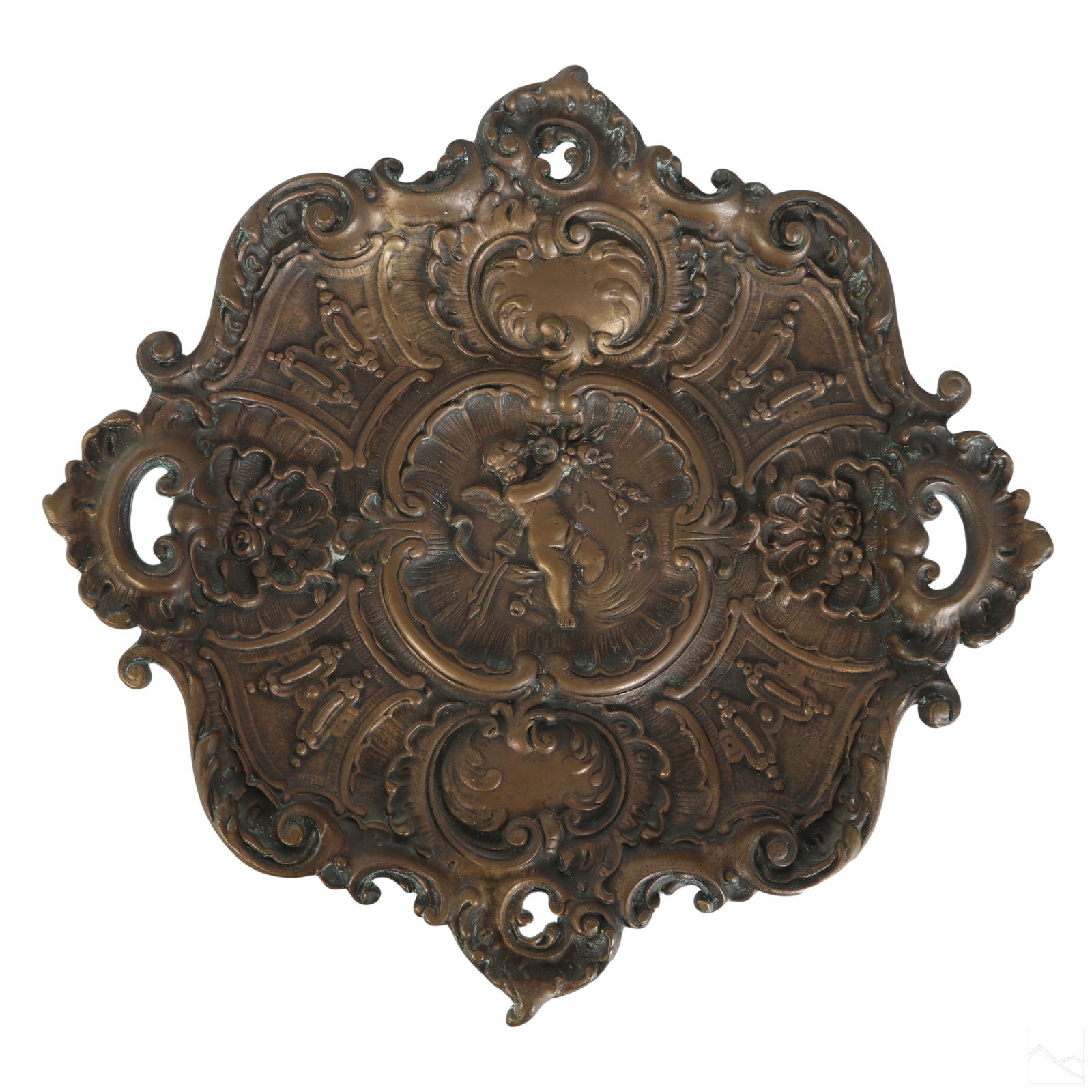 19C. Antique Figural Rococo Pierced Bronze Plaque: A 19th century antique bronze footed wall plaque. An ornate rosette shield form featuring pierced reticulated sides. Additional scrolling and flourish and floral designs, and central relief Cupid (Ero