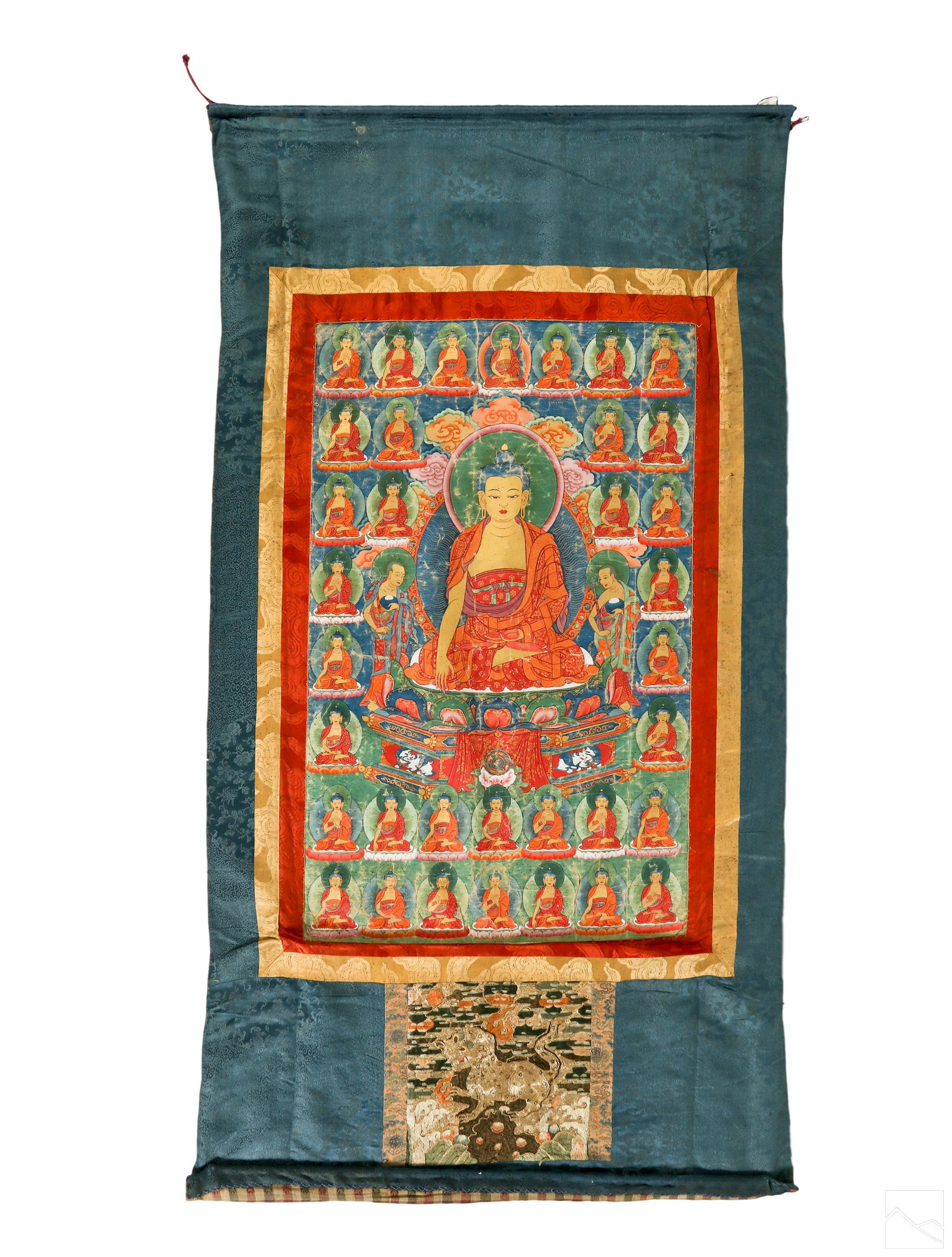 Tibetan Buddhist Antique Thangka Gouache Painting: Antique Chinese silk scroll thangka or thanka painting. A figurative work in the style of the 18th to 19th Century Tibetan School, depicting a central Gautama Buddha figure, seated on a carved lotus w
