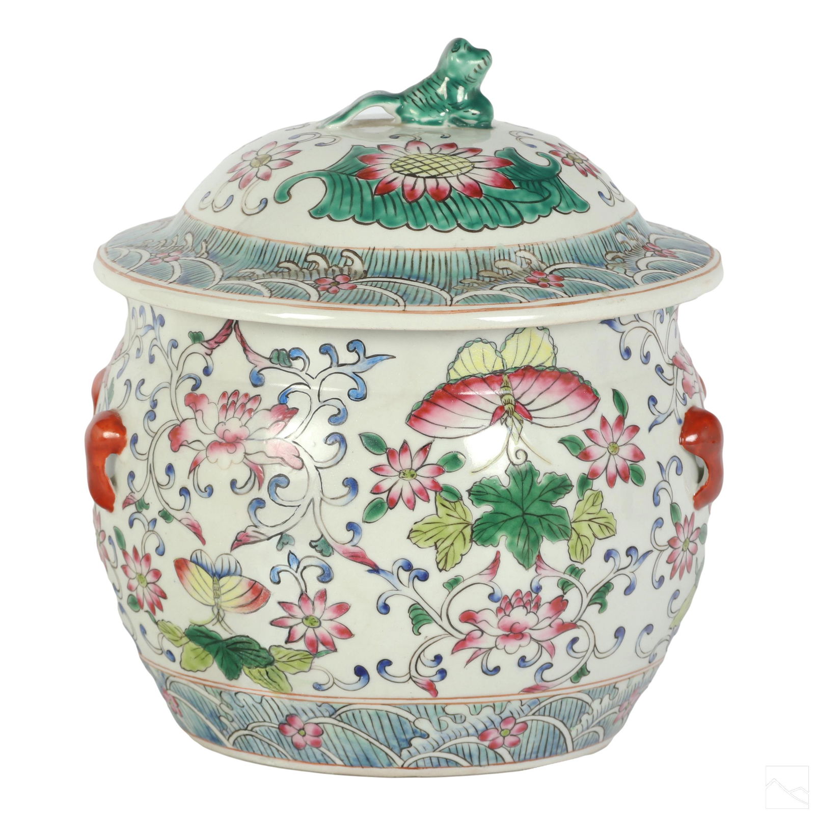 Chinese Famille Rose Style Porcelain Ginger Jar: A Chinese porcelain lidded pot form ginger jar. Features a hand painted foliate floral and butterfly design in the style of Famille Rose with a figural Foo Dog finial and four small rust red painted p