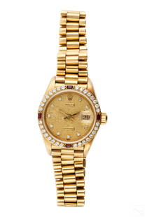 Rolex 18K Gold Diamond and Ruby Presidential Watch: A ladies Retro Rolex 18k gold Oyster President Datejust watch. Model 69068G, produced circa late 1980s. Gold jubilee dial with diamond indicators. Approximately .50 carats in diamonds at bezel, accent