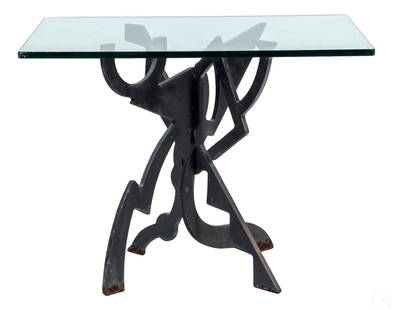 Pucci de Rossi 1947-2013 Abstract Iron Cafe Table: An Italian modern iron table by Pucci de Rossi (Italian, 1947-2013). Produced circa 1980s in patinated iron with a Modernist design on four abstract legs. Surmounted by a substantial rectangular glass