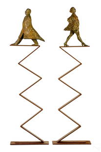 Aurora Canero b.1940 Modernist Bronze Sculptures: Aurora Canero (Spanish, born 1940). A pair of monumental patinated bronze statues. Figural works produced in a whimsical Modern Art Deco style, depicting affluent male and female modeled with delibera