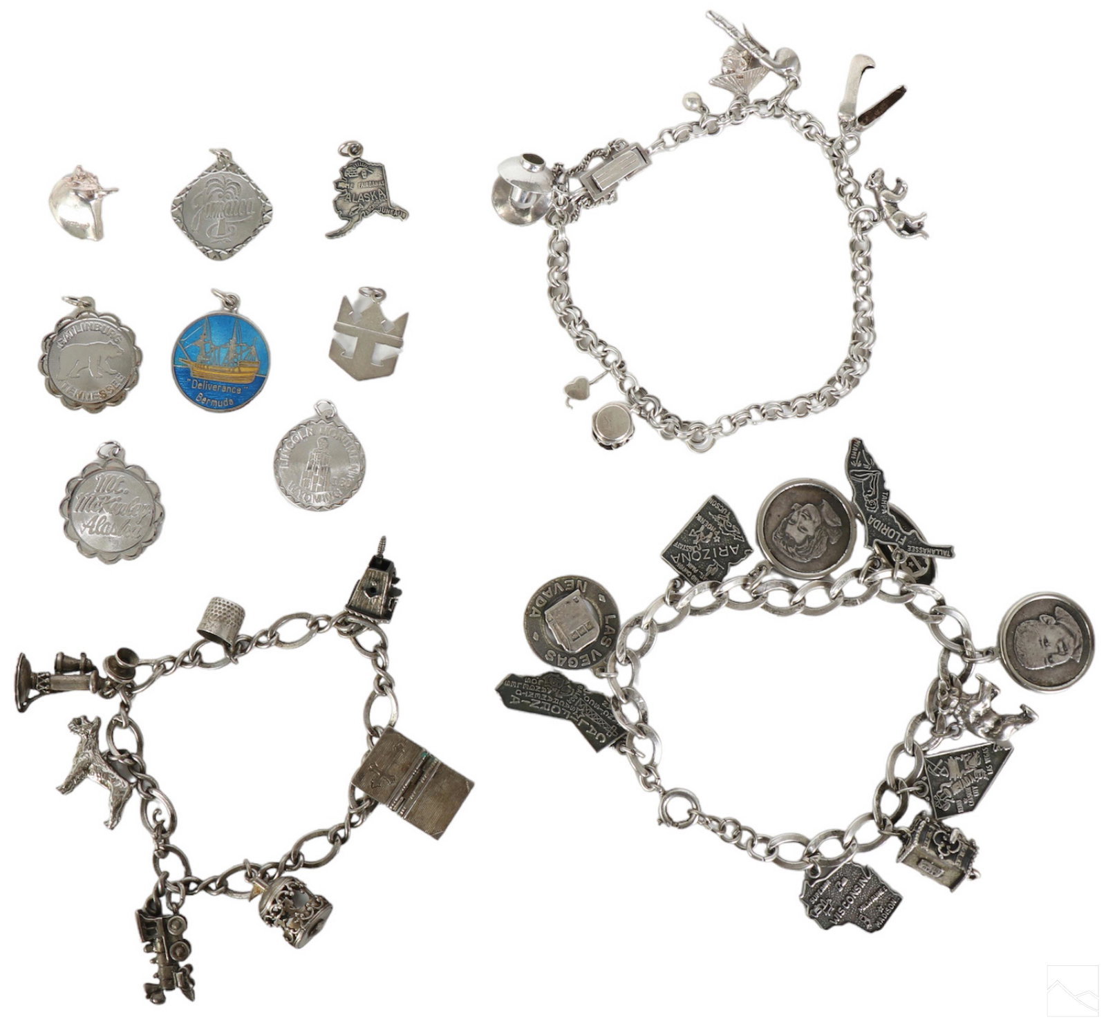 Sterling Silver Charm Bracelets & Charms LOT 115g.: A collection of eight (8) sterling silver charms and three (3) charm bracelets. Includes: one (1) double link bracelet with safety chain and eight (8) charms (7.5" wearable, .10" wide); one (1) single