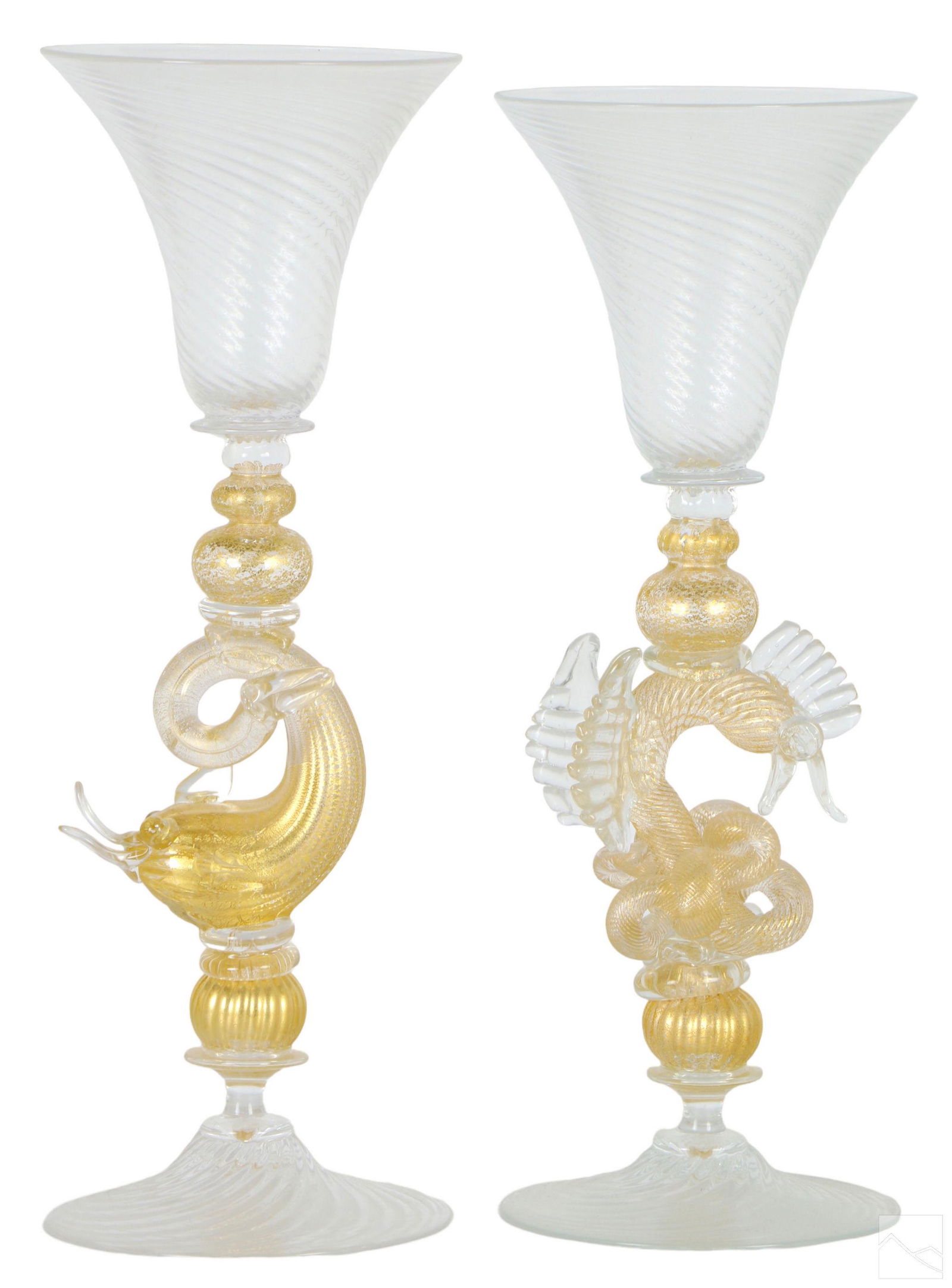 William Gudenrath Venetian Style Art Glass Goblets: A pair of studio art glass wine goblets by William Gudenrath (born 1950). Hand crafted in the Venetian art glass style with mythological depictions of dolphins and seahorses. Both signed and dated WM.