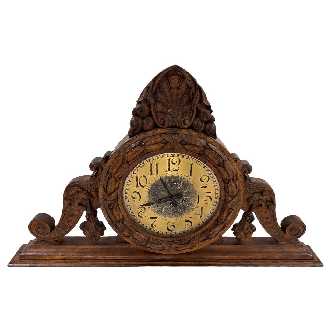 Magneta Swiss Antique Architectural Mantle Clock: A Swiss antique carved wood mantle clock by Magneta Clock Co. (Zurich). An architectural display cabinet clock featuring a two-tone metal dial with black Arabic numeral hour markers. Artisan carved gr