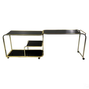 Milo Baughman Designer Brass and Glass Bar Trolley: An expandable bar cart trolley designed for Design Institute America (High Point, NC) by Milo Baughman (1923-2003). A late Mid Century Modern design, produced circa 1980s, designed in three tiers, wit