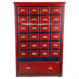 Apothecary Drug Store Chemist Antique Wood Cabinet: An antique wood apothecary chemist's pharmacy chest of drawers cabinet, produced early 20th Century, or possibly earlier. Artisan crafted body hand painted in a rich red, with blue to sides, having 24