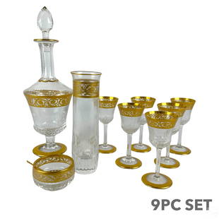 St. Louis French Crystal Thistle Gold 9pc. Service: A nine (9) piece Saint Louis French crystal table service produced in the Thistle Gold pattern. Designer art glass with hand applied gold leaf embellishments in scrolling, feathered, and botanical des