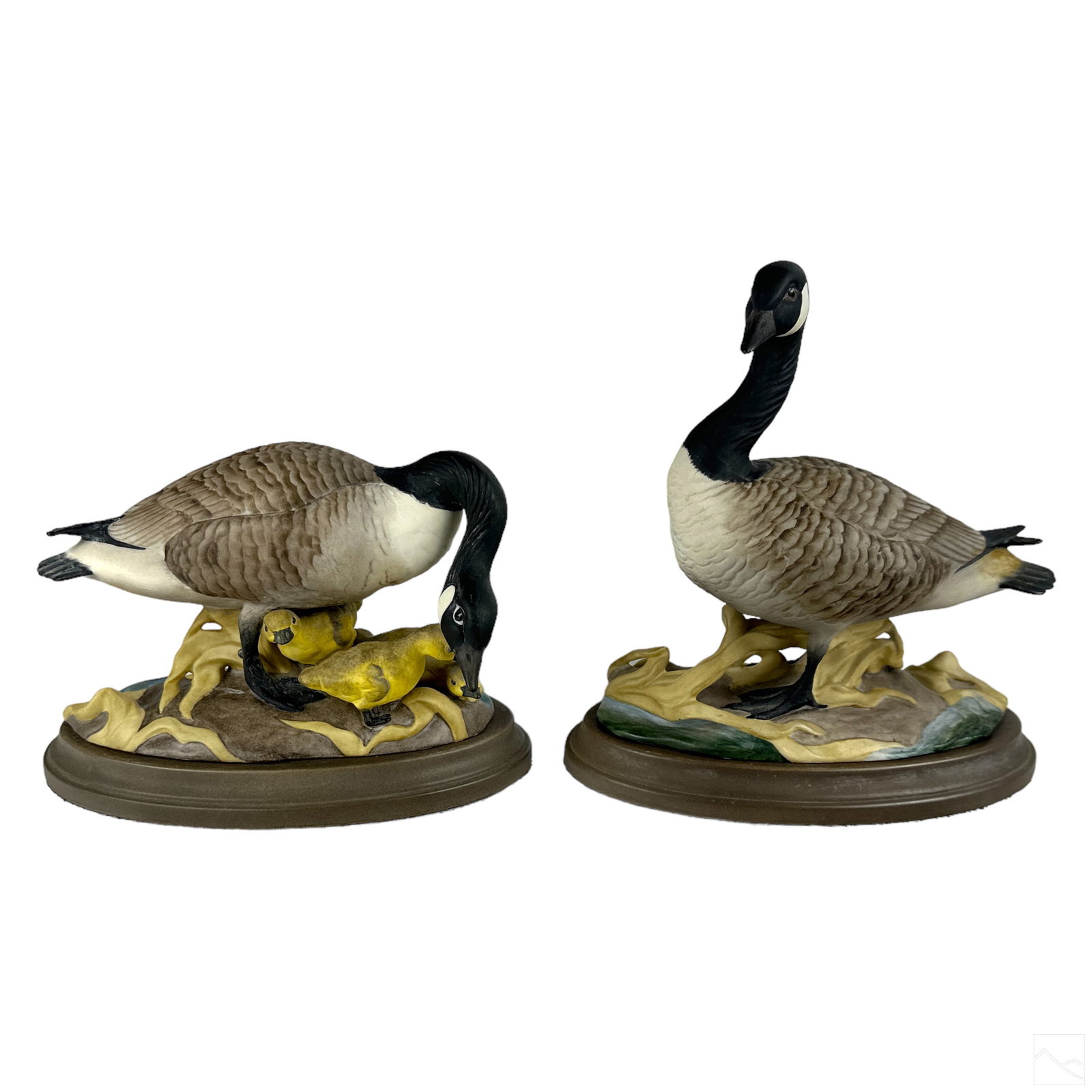 Boehm Bone China Pair Geese Mates Birds Figurines: A pair of Boehm American bone china porcelain sculptures. Bisque finish works modeled as Canadian geese. Includes: one (1) figural group with mother goose and trio of chicks (measures approximately 4.