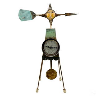 Boho Chic Industrial Designer Folk Art Table Clock: A mixed media clock sculpture, produced circa 1990s by Faco Metal Products (Providence, R.I.) in the style of Sergio Bustamante and similar contemporary artists. Metal, wood, paper, and other elements