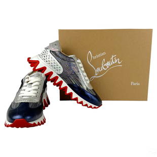 Christian Louboutin Flat Blue Low Sneakers Sz 38: A pair of Christian Louboutin Loubishark Donna Flat Blue Red Platform Low Top Sneakers. Marked size 38 (European). Silvered chromed leather with white sole and chromed embellishments. Lightly preowned