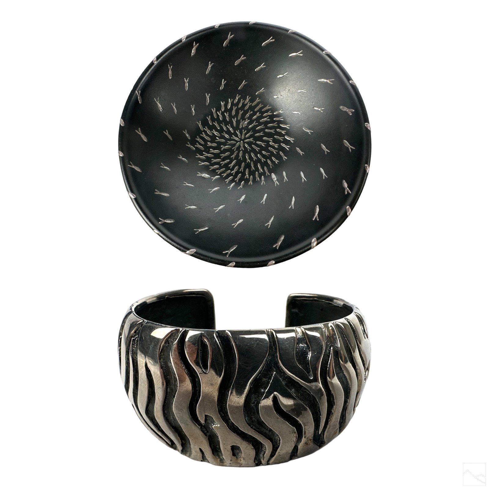 Emilia Castillo Art Pottery & Silver Bowl and Cuff: A Mexican black art pottery bowl by Taxco designer Emilia Castillo (born 1958). Modernist design with interior decorated in a profusion of inlaid silver schooling fish, and surmounting a tri-footed si