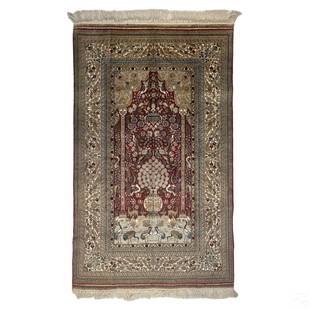 Oriental Hand Knotted Silk Prayer Rug Area Carpet: A 20th century hand knotted silk type area carpet or prayer rug. Hand woven with striking designs of florettes and other botanical elements, birds, animals, architectural elements and arabesques, and