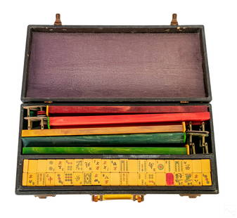 Chinese Vintage Mahjong Game Set & Bakelite Tiles: A vintage Chinese Mahjong game set, produced circa 1950s. Multi colored bakelite. Complete game set. Five racks and 144 tiles. In fitted case with bakelite handle. No apparent signature. Dimensions: 3