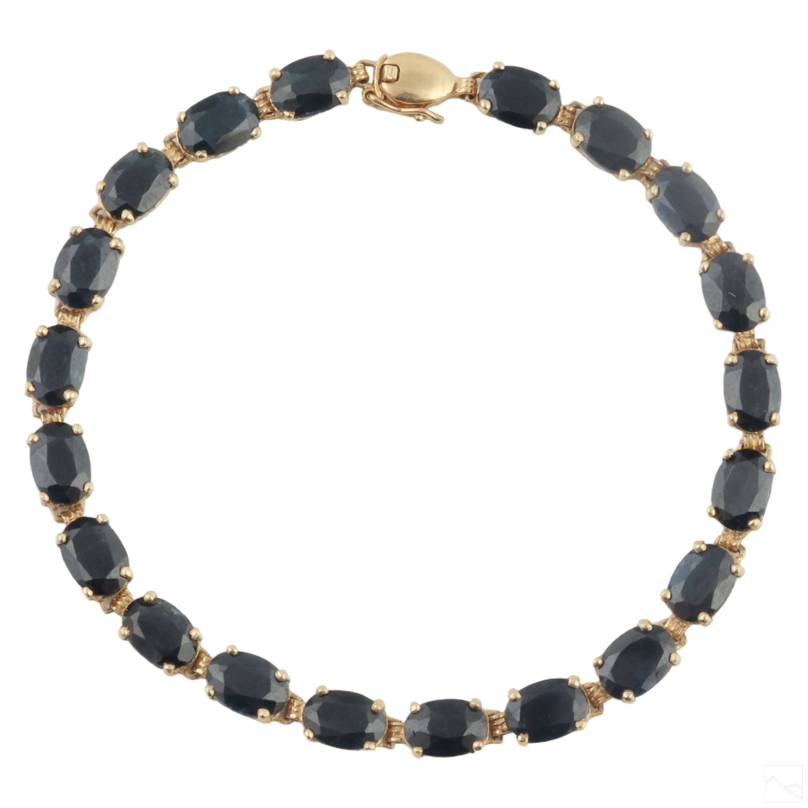 14K Yellow Gold Midnight Sapphire Tennis Bracelet: An elegant vintage 14k yellow gold and dark midnight sapphire tennis bracelet. Features 20 oval cut sapphire gemstones measuring 6x4mm. Total carat weight 12CT. Secure clasp with safety. Marked 14k. T