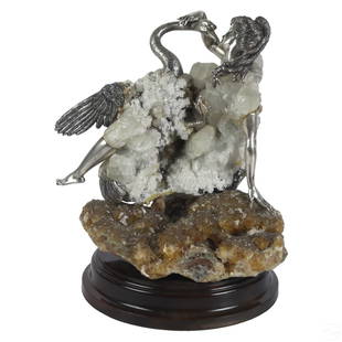 Carrera y Carrera Quartz Silver Figural Sculpture: An authentic sculpture by Carrera y Carrera (Madrid). An artisan made figural work in natural clear quartz crystal, with detailed silver repousse elements, depicting a female figure with a swan.