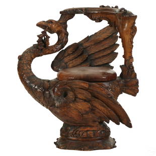 Italian Antique Carved Wood Phoenix Vanity Chair: A Victorian style wooden fantasy vanity accent chair. An elaborate hand carved phoenix, swan or similar avian bird form having realistic hand carved details, and supporting a circular padded leather