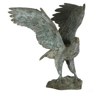 Bronze Life Size 57" American Bald Eagle Sculpture: A monumental life like bronze American bald eagle garden statue. A patriotic work modeled with outstretched wings, and presented on a landscape form base. Well cast and heavy, with realistic detail