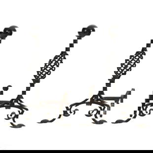 Arts & Crafts Wrought Iron Fireplace Andirons SET: A pair of Arts & Crafts black wrought iron fireplace andirons. Featuring twist, turns and bends by a master blacksmith. No apparent makers mark.. Dimensions: 26 X 27 X 16 in. Condition: Good over